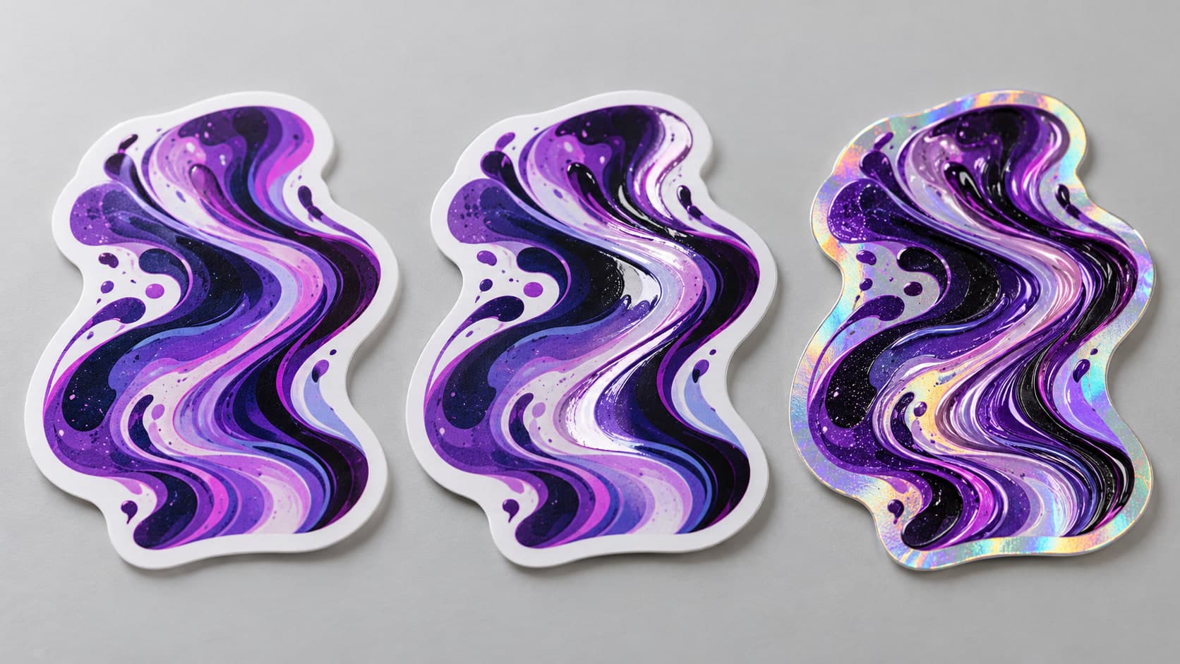 Three die-cut labels side by side in matte, gloss, and holographic finishes